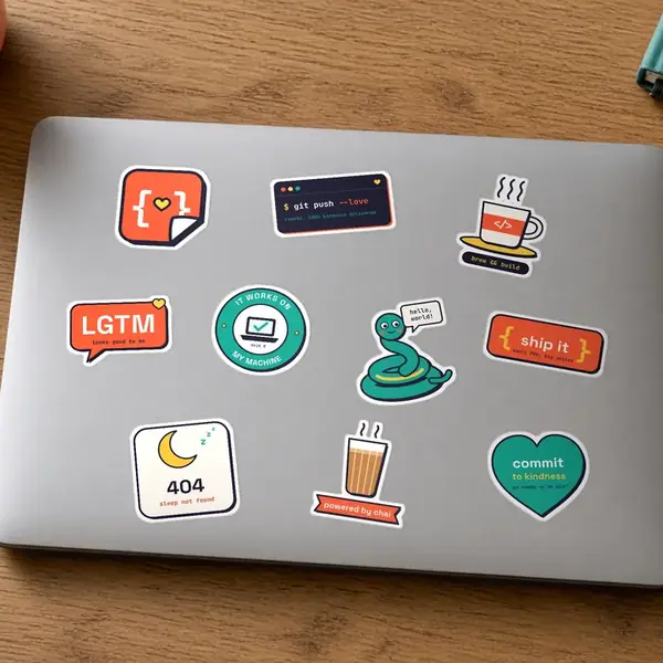 Ten StickerCon stickers applied on a laptop lid.